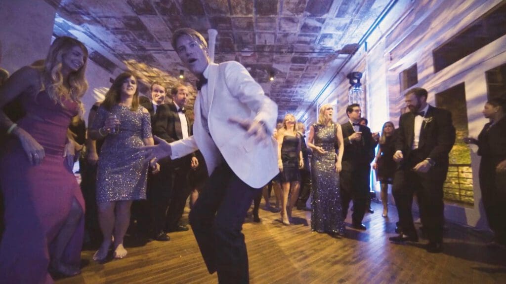 Groom dancing during wedding reception