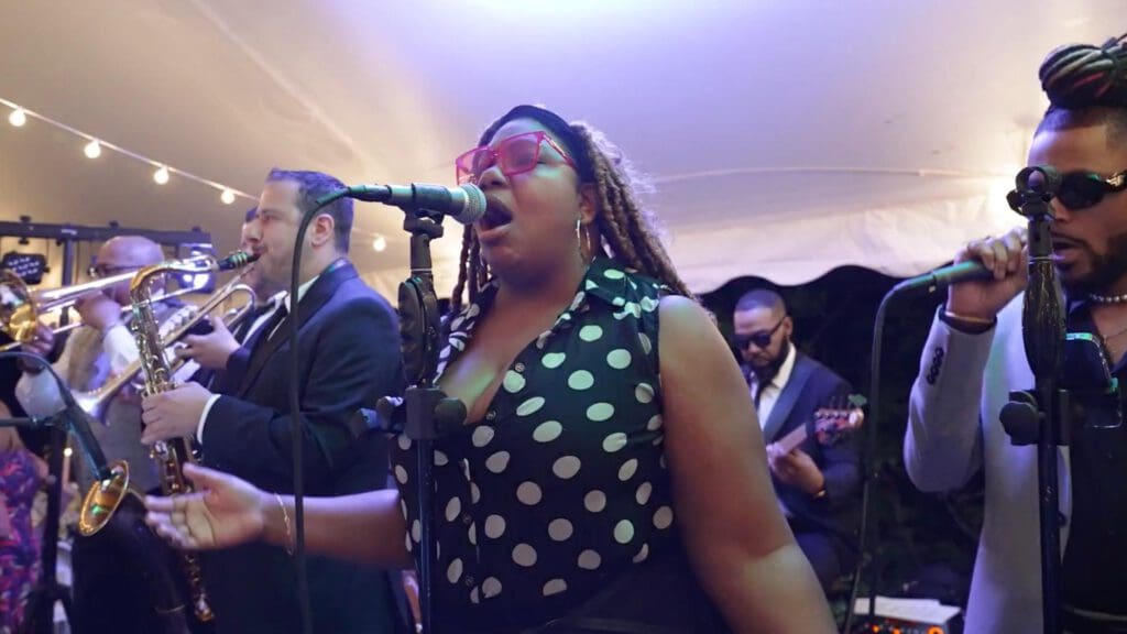 Live wedding band singer performing during wedding reception
