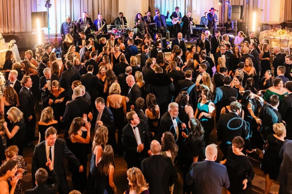 People dancing to live music during corporate event