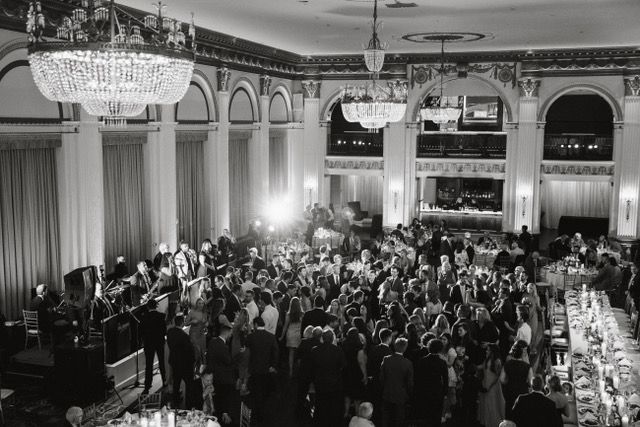 Large wedding reception with Jack Faulkner Orchestra performing with people dance