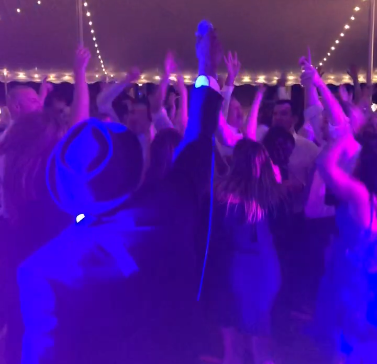 Group of people dancing at wedding